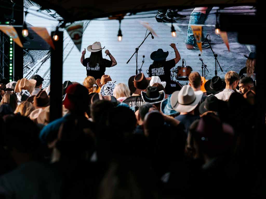 Festival crowd line dancing at Nashville Days Bridge House Barn 2025